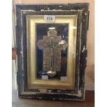 A late 19th Century framed religious icon depicting Crucifix with the Twelve Stations of the Cross