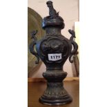 An Oriental bronze lidded urn with cast seal mark to base - one handle a/f