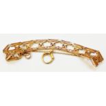 An early 20th Century marked 9c rose metal fancy gate-link bracelet with safety chain