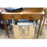 A 34 1/2" 19th Century mahogany and ebony strung side table with two frieze drawers, set on ring