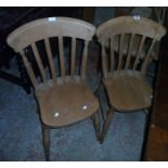 Three matching 20th Century blonde wood Windsor kitchen chairs with solid sectional seats, set on