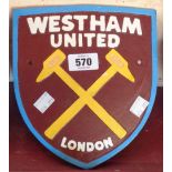 A reproduction painted cast iron West Ham United sign