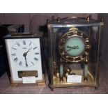 A Kundo vintage anniversary clock - sold with a Smiths brass cased carriage style clock with battery