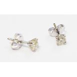 A pair of marked 750 diamond solitaire stud ear-rings - 0.70ct. TDW