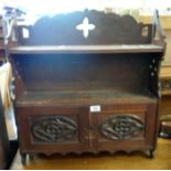 A 23" late Victorian stained oak wall mounted shelf unit with pierced and incised decoration and