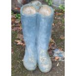 A garden planter in the form of a pair of wellington boots