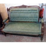 A 5' Victorian walnut show frame settee with original button back tapestry upholstery, decorative