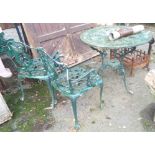 A painted cast iron garden table and pair of chairs