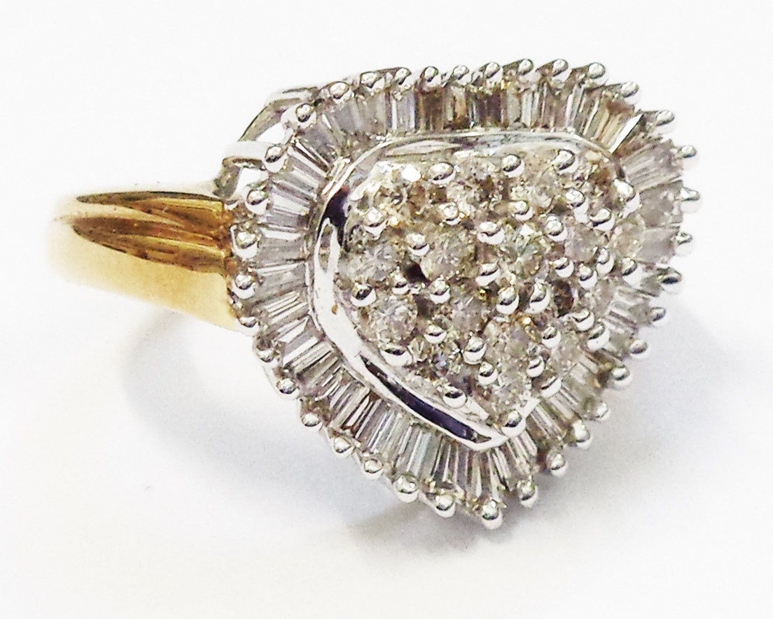 A hallmarked 750 gold heart shaped ring, set with diamond cluster within a baguette diamond border