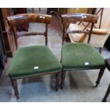 A pair of 19th Century mahogany framed dining chairs with curved top rails, tulip splats and