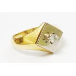 A marked 18k diamond solitaire signet ring with two colour square panel top
