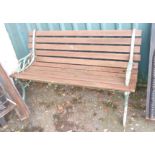 A slatted garden bench with cast metal ends