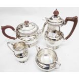 A William Greenwood & Sons silver three piece tea set of baluster form with decorative cast rims -