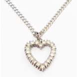 A diamond encrusted heart shaped pendant, on marked 375 white metal kerb-link neck chain