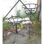 Two painted wrought iron garden planter stands