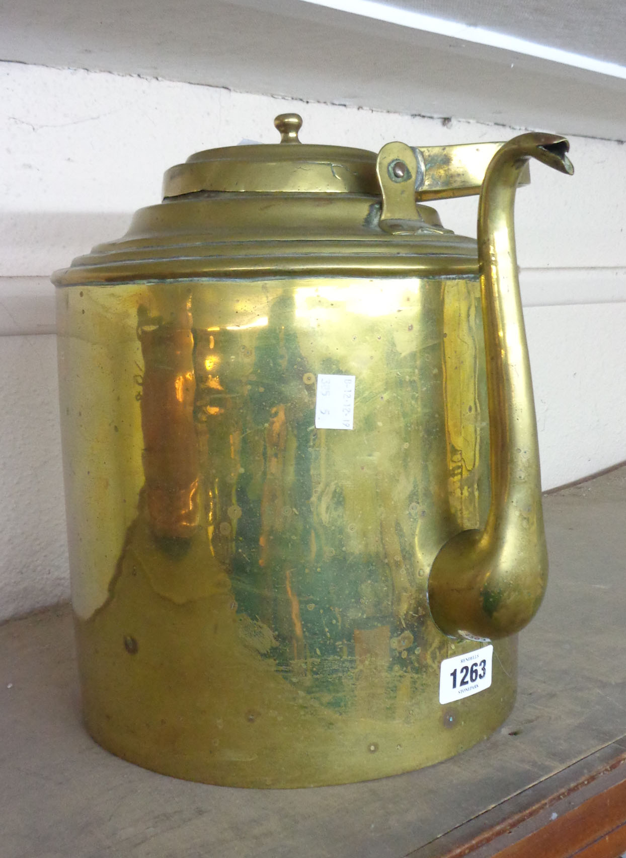 A large brass kettle