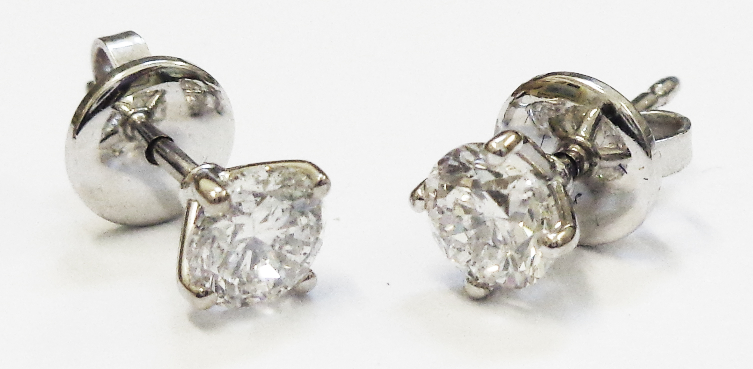 A pair of diamond solitaire stud ear-rings with marked 750 butterflies - 1.30ct. TDW