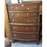 A 35" 20th Century polished mixed wood bow front chest of six long graduated drawers in the style of