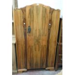 A 36" mid 20th Century walnut low wardrobe with applied moulded Art Deco style decoration and