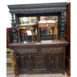 A 5' Victorian carved and stained oak mirror back sideboard with flanking acanthus turned supports