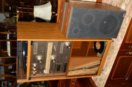 AN AMSTRAD COMPONENT HI-FI IN A MODERN CABINET comprising of a amplifier, turntable, tuner, cassette