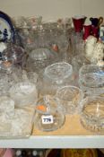 A COLLECTION OF CUT GLASS ETC, to include vases, fruit bowls and drinking glasses, together with a