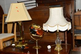A BRASS COLUMN TABLE LAMP with shade, brassed circular dressing mirror and a modern glass table lamp