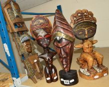 FOUR PIECES OF AFRICAN TRIBAL CARVINGS, a seated figure with inset beads to the face, a head with