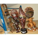 FOUR PIECES OF AFRICAN TRIBAL CARVINGS, a seated figure with inset beads to the face, a head with