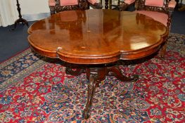 A VICTORIAN BURR WALNUT AND INLAID BREAKFAST TABLE with a wavy edged top on a scrolled tripod