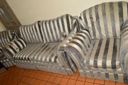 A STRIPED UPHOLSTERED THREE PIECE LOUNGE SUITE, comprising of a two seater settee and a pair of