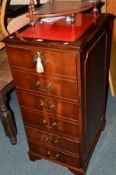 A REPRODUCTION MAHOGANY THREE DRAWER FILING CABINET with a red tooled leather top, width 49cm x