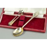 A ;PAIR OF SILVER SUGAR TONGS AND A CASED SILVER SPOON, the sugar tongs designed with talon shaped