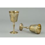 A PAIR OF ELIZABETH II SILVER GOBLETS, engraved band of fruiting vine, knopped baluster stems,