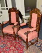A PAIR OF EARLY 20TH CENTURY HEAVILY CARVED OAK BARLEY TWIST THRONE CHAIRS, the top with a pair of