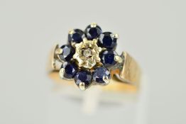 A 9CT GOLD SAPPHIRE AND DIAMOND CLUSTER RING, the central single cut diamond within a circular