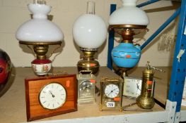 TWO OIL LAMPS AND A SIMILAR ELECTRIC EXAMPLE COMPLETE WITH GLASS SHADES, together with a vintage