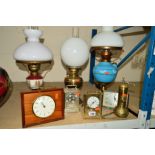 TWO OIL LAMPS AND A SIMILAR ELECTRIC EXAMPLE COMPLETE WITH GLASS SHADES, together with a vintage