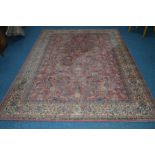 A MODERN PINK AND CREAM GROUND RUG, with a foliate design, 300cm x 300cm, together with an early