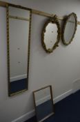 AN OVAL WALL MIRROR with floral detail, another wall mirror, rectangular wall mirror and another