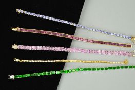 FIVE GEM LINE BRACELETS to include an oval tanzanite line bracelet, a square garnet line bracelet