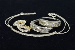A CUBIC ZIRCONIA BRACELET, EARRING AND TWO RINGS, the bracelet designed as a thin curved bar set