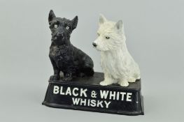 A CAST METAL BUCHANAN'S 'BLACK AND WHITE WHISKY' ADVERTISING GROUP, modelled as a pair of black