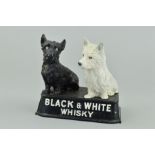 A CAST METAL BUCHANAN'S 'BLACK AND WHITE WHISKY' ADVERTISING GROUP, modelled as a pair of black