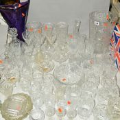 A QUANTITY OF CUT GLASS etc to include a large vase, approximate height 30cm, other vases, fruit