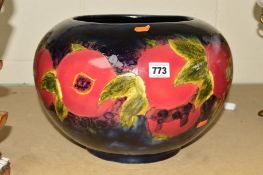 A LARGE MOORCROFT STYLE JARDINIERE decorated with a pomegranate style decoration, approximate height