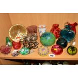 A GROUP OF GLASSWARES, to include a Millefori paperweight/dumpy weight, cranberry coloured glass etc