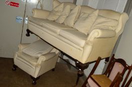 A VICTORIAN MAHOGANY CREAM THREE SEATER UPHOLSTERED THREE PIECE LOUNGE SUITE comprising of a settee,