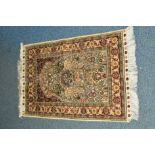 A 20TH CENTURY CAUCASIAN STYLE SILK RUG, cream ground with foliate detail and multi strap border,