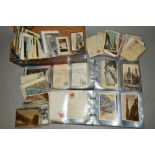 A QUANTITY OF POSTCARDS, loose and loosely inserted in two albums, Edwardian to late 20th Century